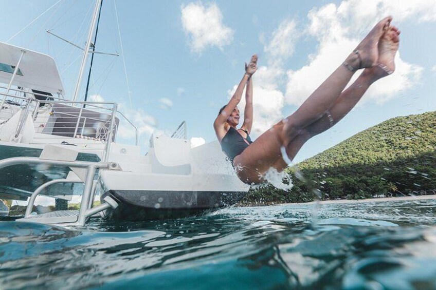 A person diving off a boat into the water. 4