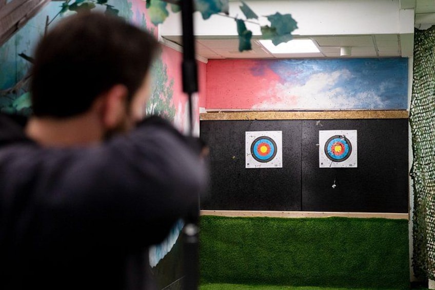 A person aiming at two targets. 2