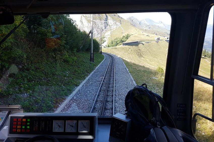A train track with a mountainous landscape in the background. 2