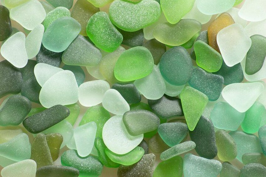 A collection of translucent, green-colored glass pieces. 1