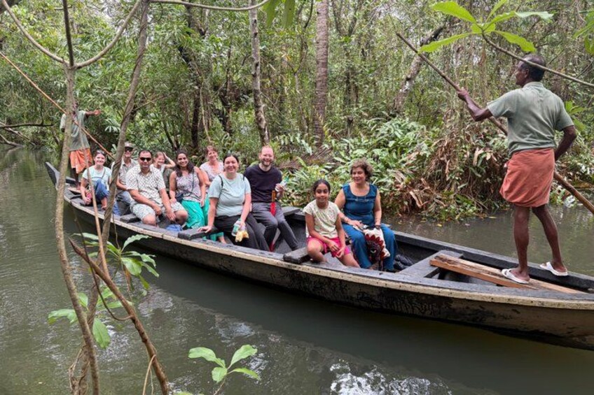 A group of people in a boat on a river surrounded by dense vegetation. 4