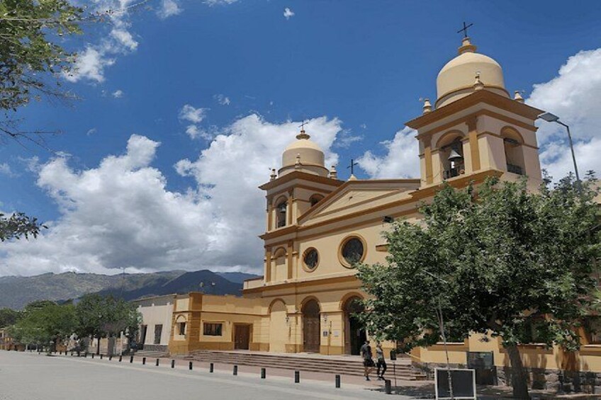 A church with two domes and a bell tower. 2