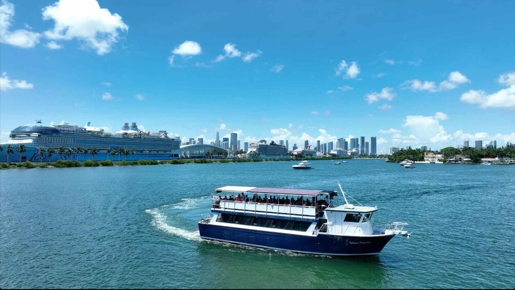 A cruise ship, a ferry, and a city skyline across a body of water. 5