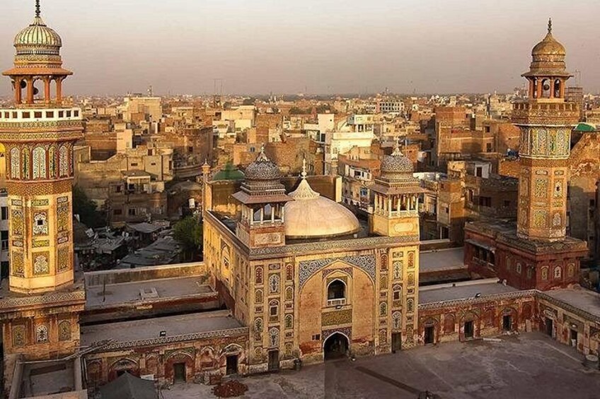 A historic cityscape with ornate architecture, including domed buildings and minarets. 4