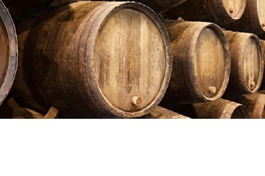 Wooden barrels stacked closely together. 3