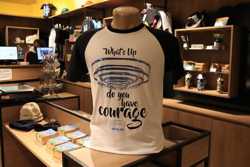 A mannequin in a store displaying a t-shirt with motivational text. 5