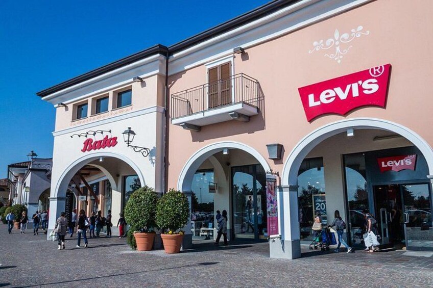 A shopping area with storefronts including Levi's and Bati. 4