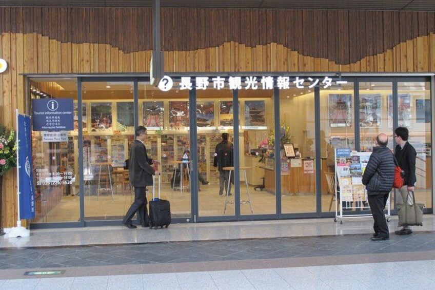 A building with a sign that reads 'Tourist Information Center.' 2