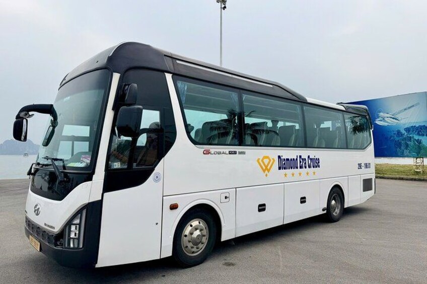 A white bus with 'Global' and 'Diamond Era Cruise' branding parked on a tarmac. 2