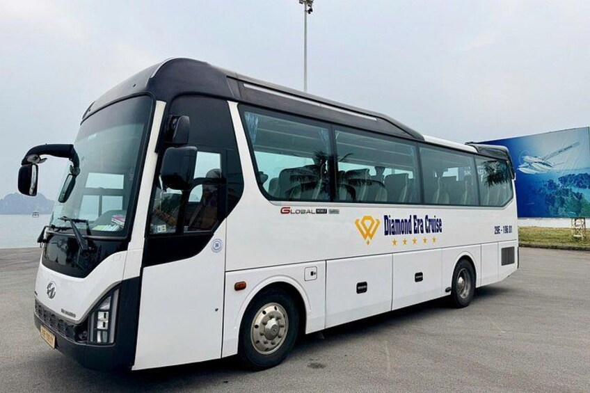 A white bus with 'Global' and 'Diamond Era Cruise' branding parked on a tarmac. 2