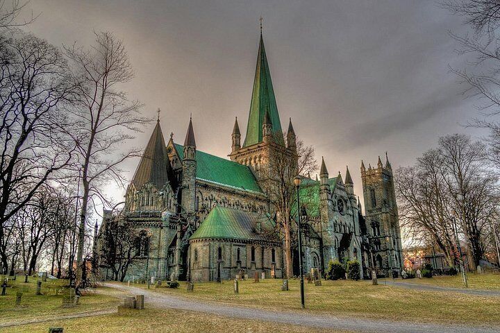 A Gothic-style church with a tall spire and multiple towers. 4