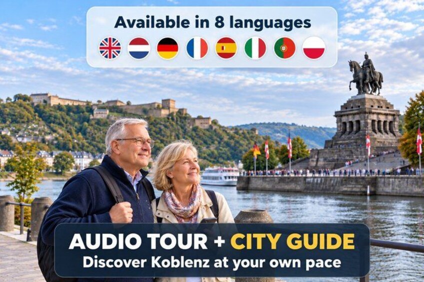 A couple enjoying a scenic view of Koblenz with a statue and a river in the background. 1