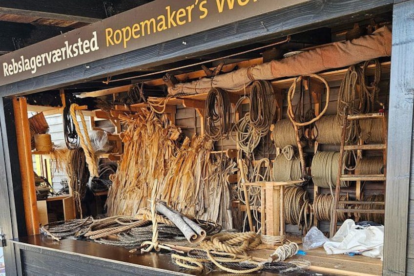 A rope shop with various ropes and ropes hanging on shelves. 2