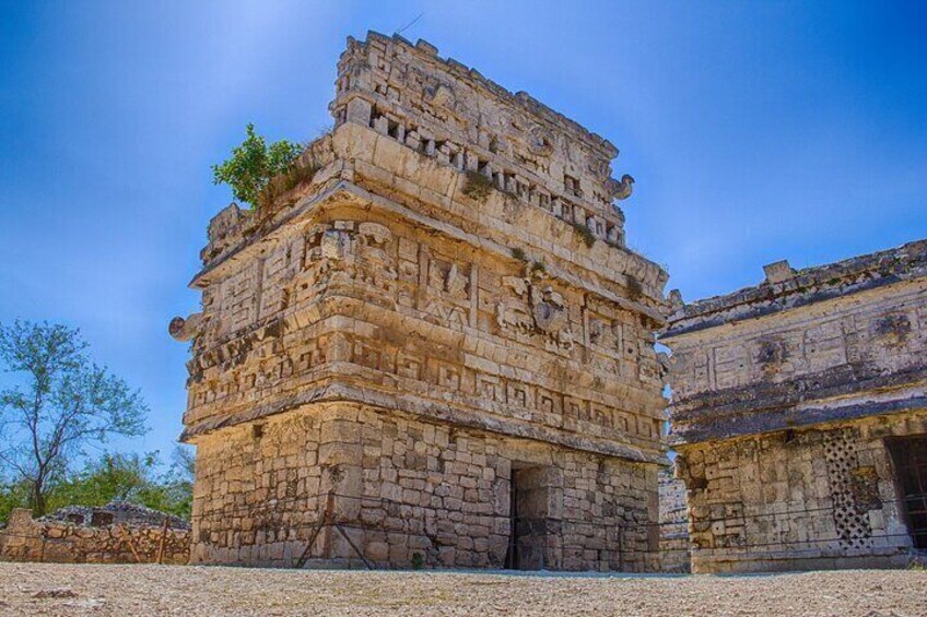 A large, ancient stone structure with intricate carvings and multiple levels. 1