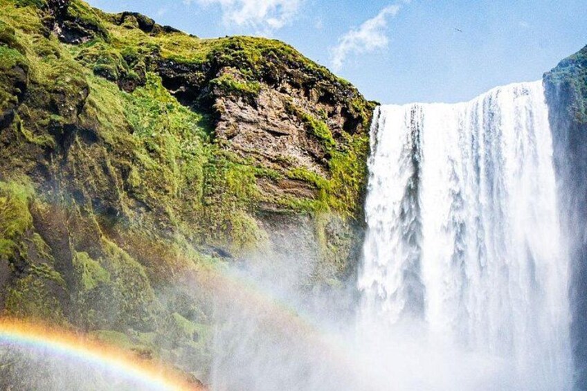 A waterfall with a rainbow. 2