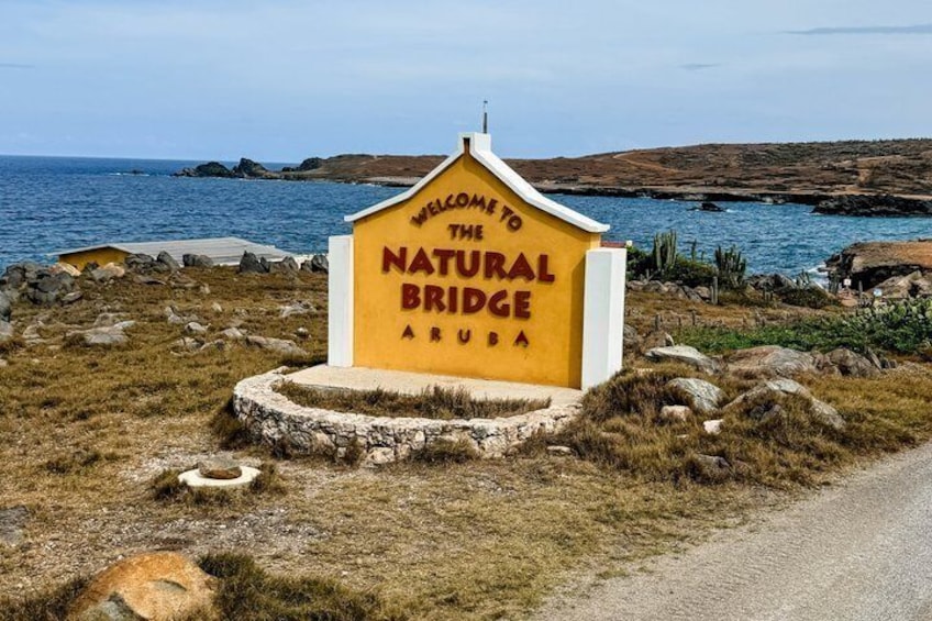 A sign welcoming visitors to the Natural Bridge in Aruba. 3