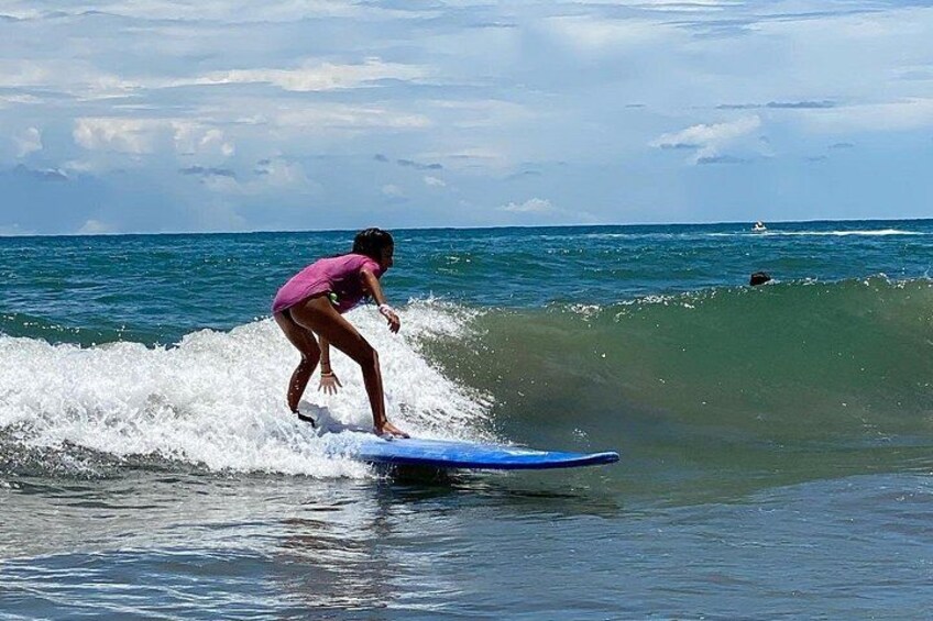 A person surfing on a wave in the ocean. 3
