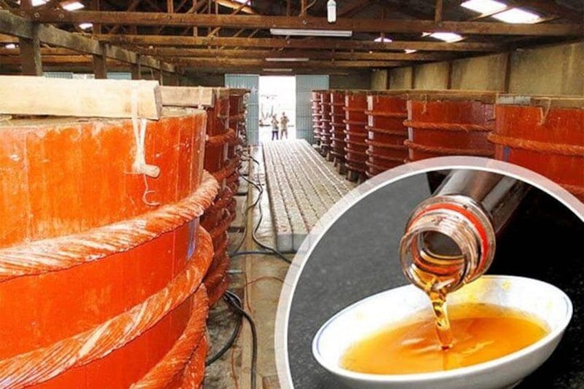 A large industrial facility with orange machinery and a white bowl with a liquid being poured into it. 4