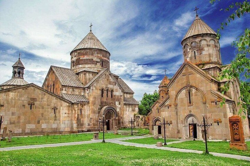 A historic church with multiple domes and a central entrance. 3