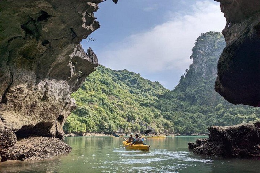 A river with a raft, surrounded by rocky cliffs and lush greenery. 3