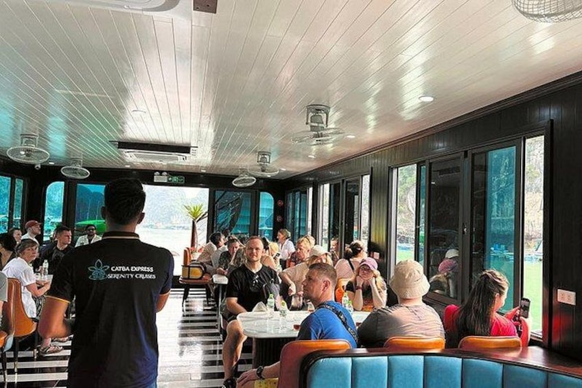 A restaurant with people dining inside. 5