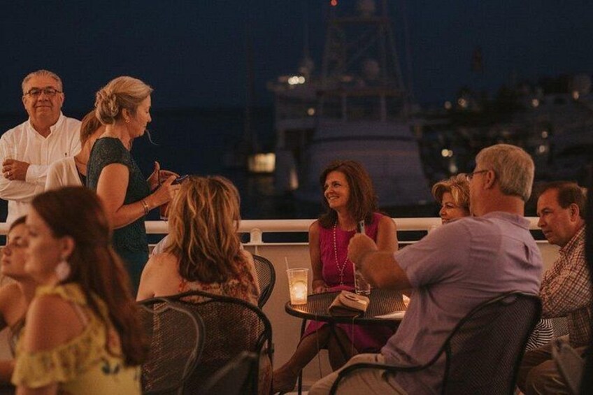Guests mingling outside aboard SOLARIS. 3