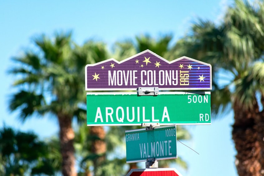 A street sign with 'MOVIE COLONY' and 'ARQUILLA RD' labels. 1