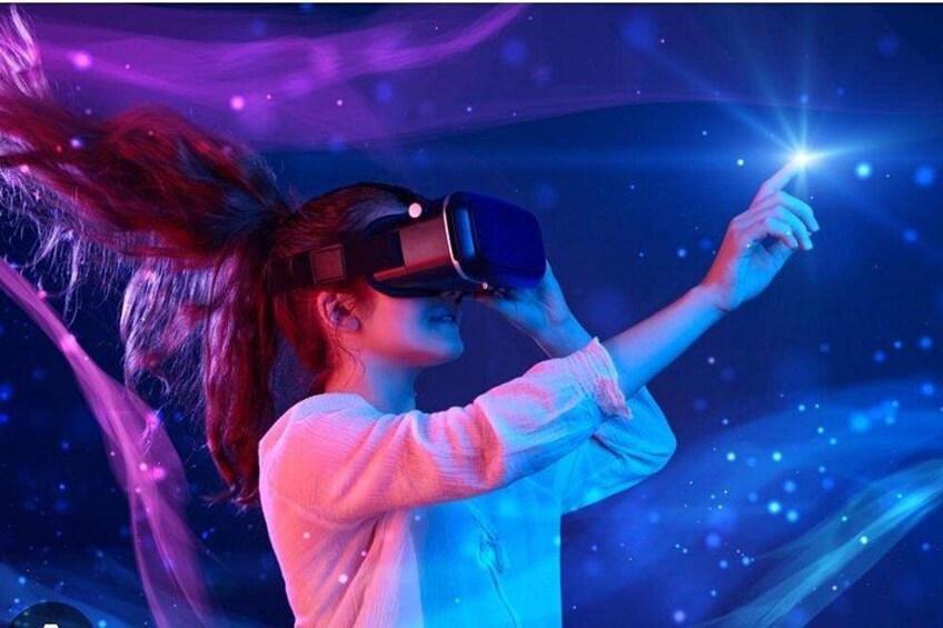 A person wearing a virtual reality headset, interacting with a virtual environment. 1