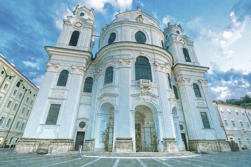 A large white church with two towers and a dome. 5