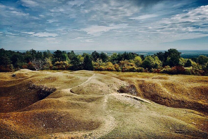 A hilly landscape with a dirt path. 2