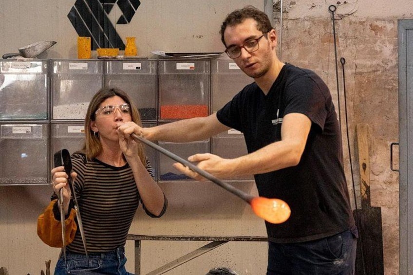 A person playing a violin and another person holding a ladle. 2