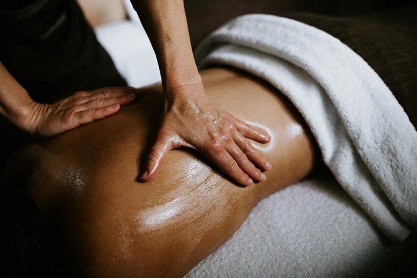 A person receiving a massage on their back. 2