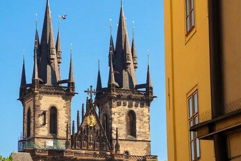 A historic church with two tall spires and a clock tower. 3