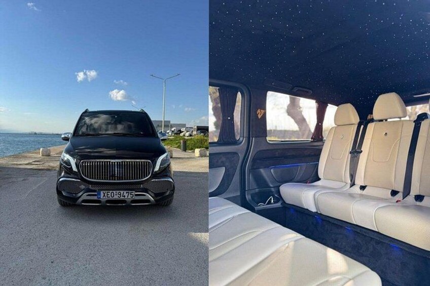 Un SUV de lujo negro estacionado frente al mar, con un cielo estrellado visible a través de las ventanas. 3