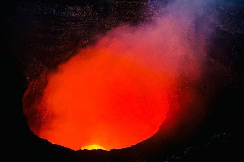 A volcanic crater with a glowing red glow. 4