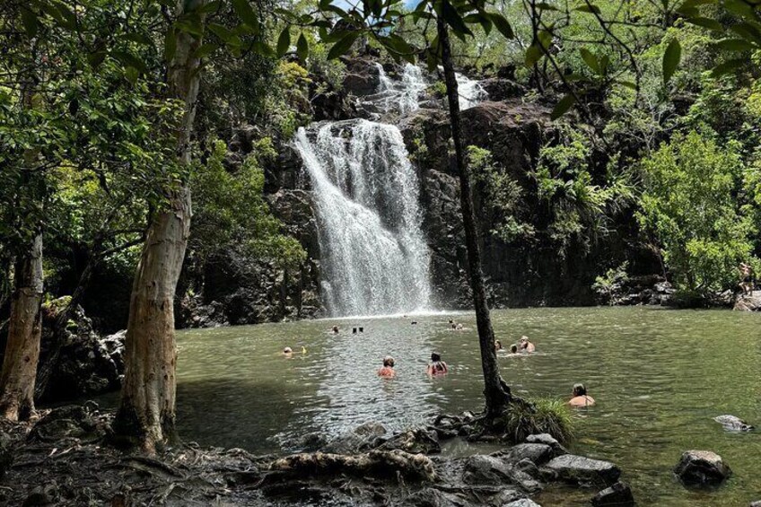 Travellers enjoying the Cedar Creek Express Tour from Airlie Beach — a refreshing rainforest escape with time to swim and relax. 1