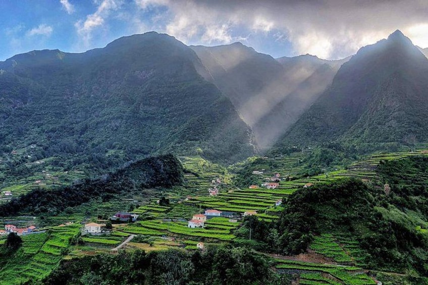 Terraced fields, a valley, and mountains. 3