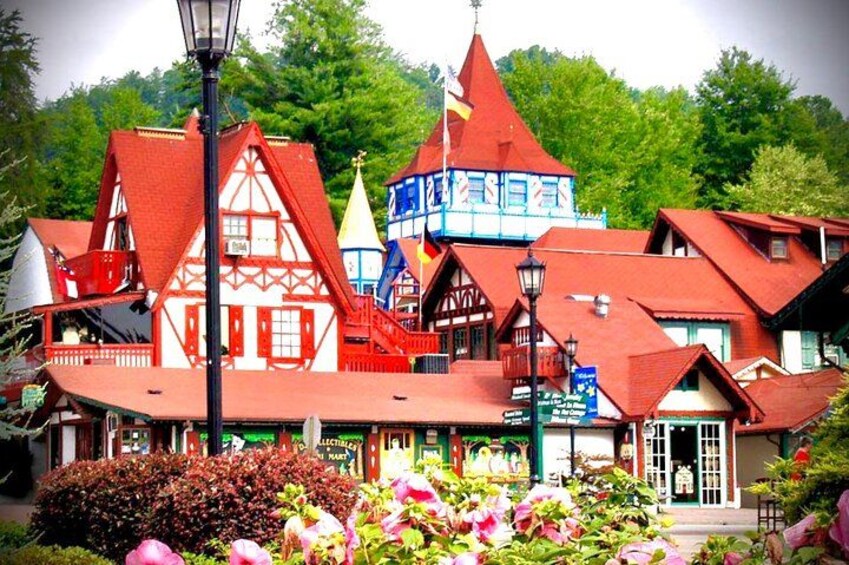 A colorful building with a red roof and a blue tower. 1
