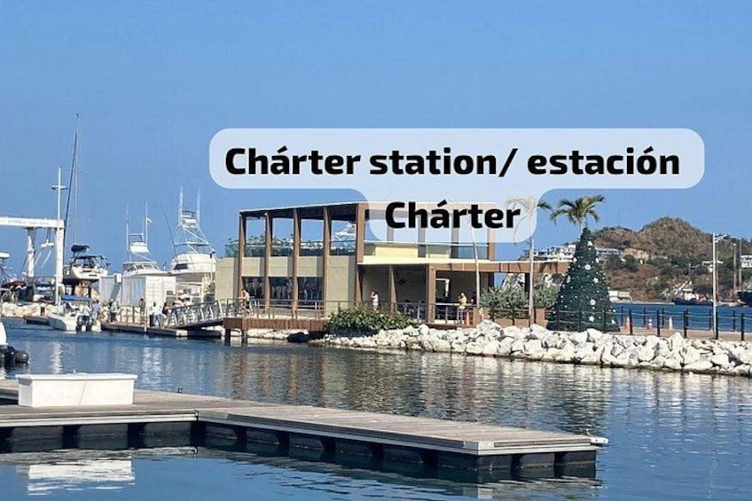A marina with boats, a wooden dock, and a modern building with a glass facade. 2