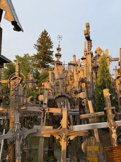 A complex wooden structure with intricate carvings and multiple crosses. 5