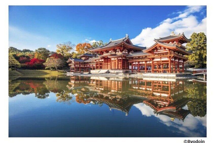A traditional Japanese building with a reflection in the water. 1