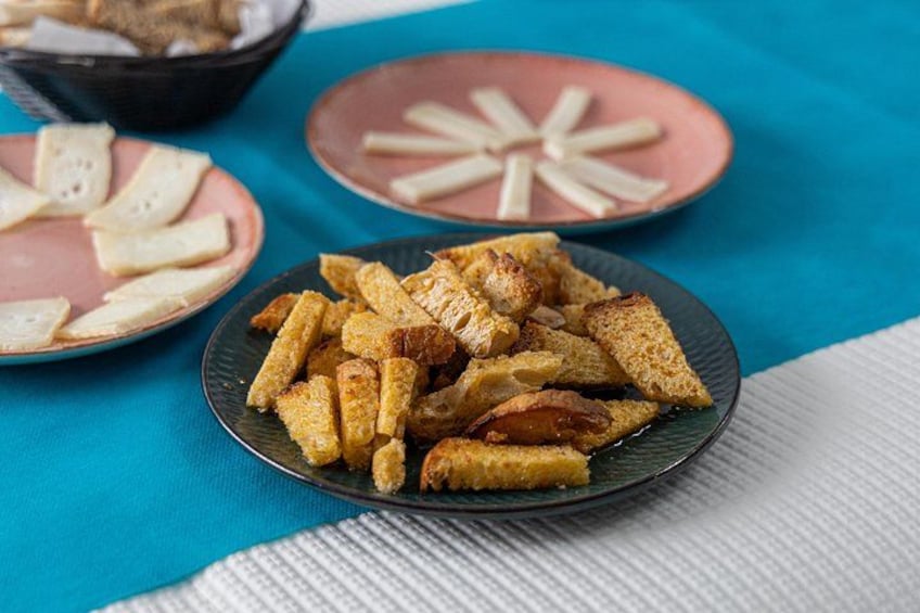 A plate of crispy fried snacks on a blue tablecloth. 5