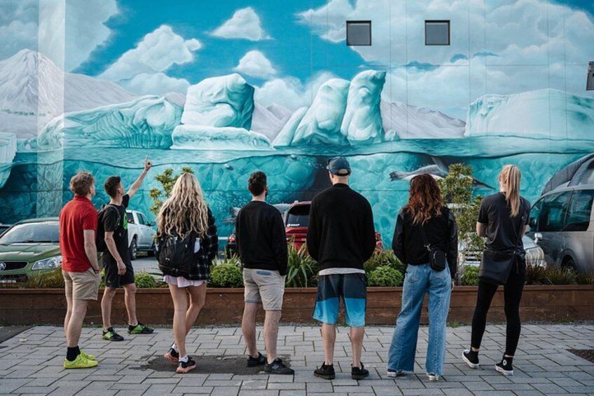 A mural of icebergs on a building wall. 2