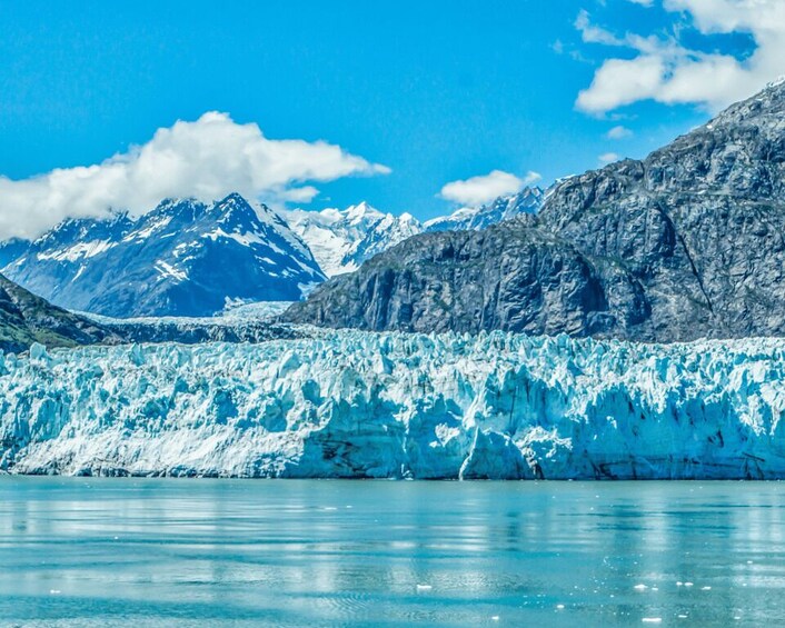 A glacier with a mountain range in the background. 2