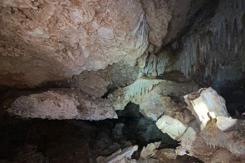 A cave interior with stalactites and stalagmites. 3
