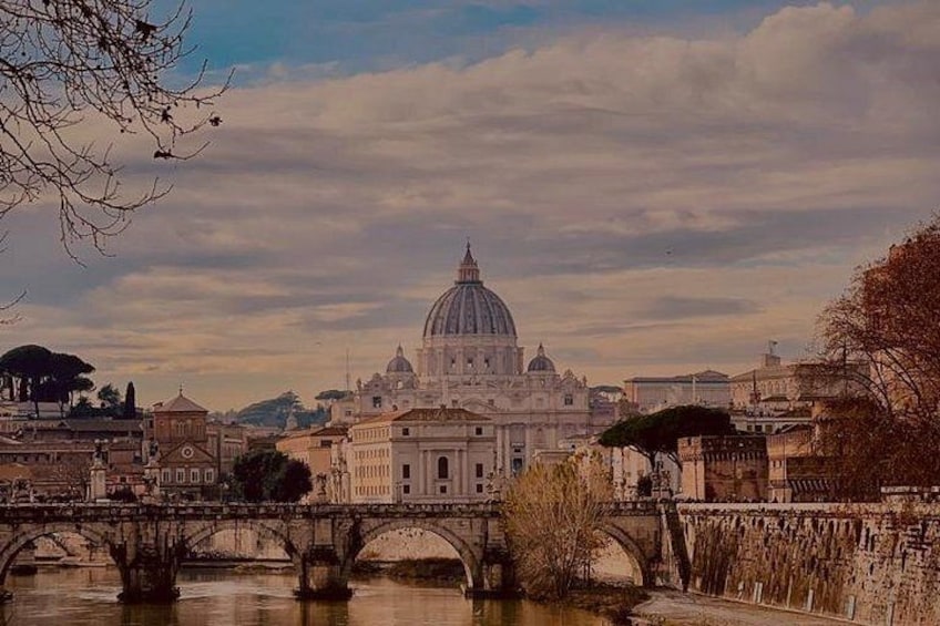 A river with bridges, a large dome-shaped building, and surrounding cityscape. 3