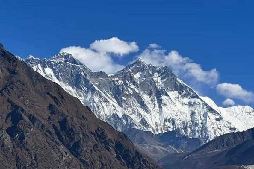 A snow-capped mountain range under a clear blue sky. 2