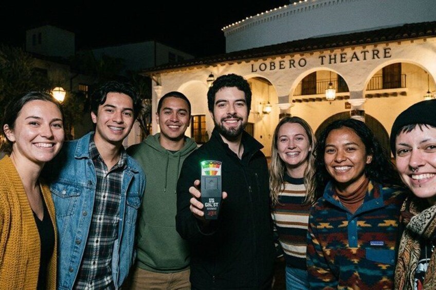 A group of people in front of the Lobero Theatre. 5