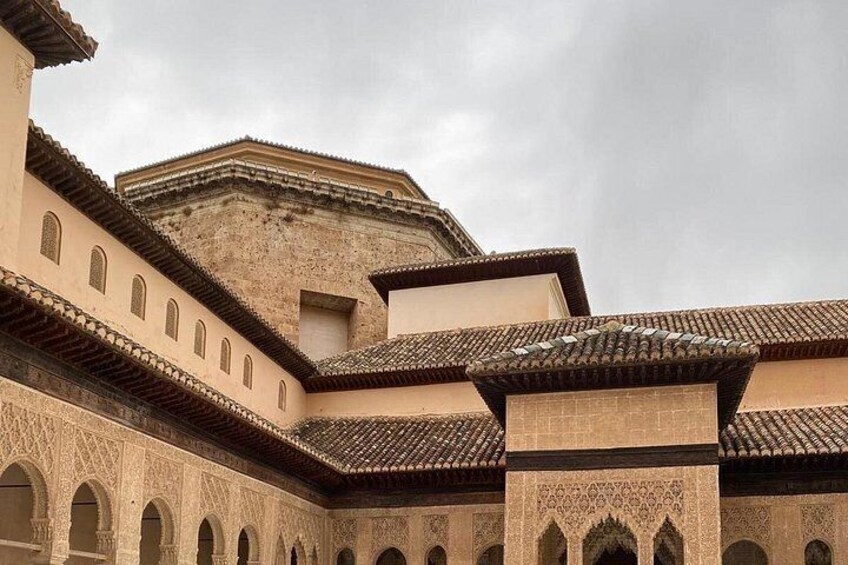 A historic building with arched windows and intricate tile work. 2