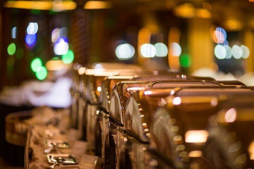A row of bar stools with metal legs and a reflective surface. 3